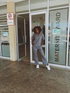 Ebahi Ikharo, standing in front of the maternity ward of Windhoek Central Hospital in Namibia